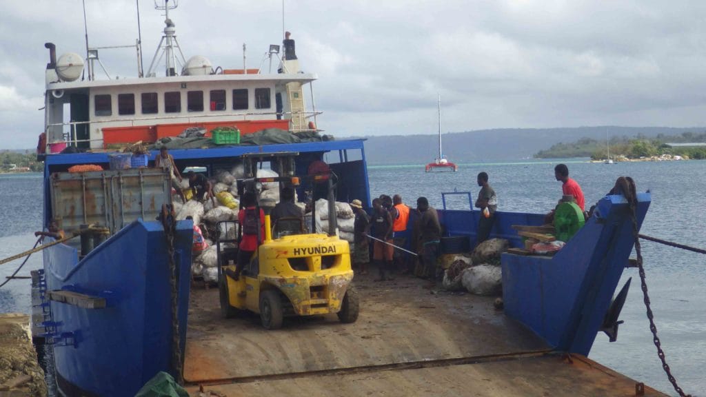 ship unloading a delivery of kava root to Vanuatu