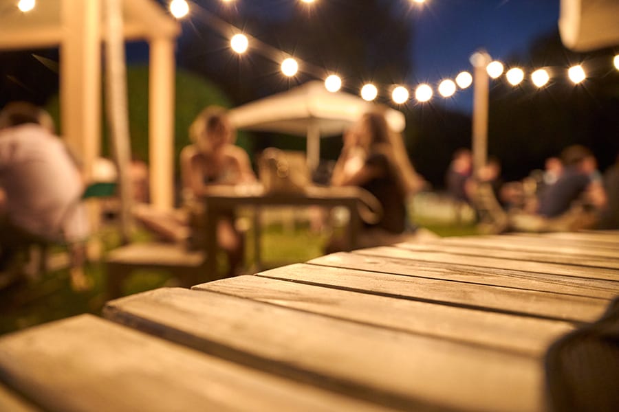 People chatting at night in a kava bar